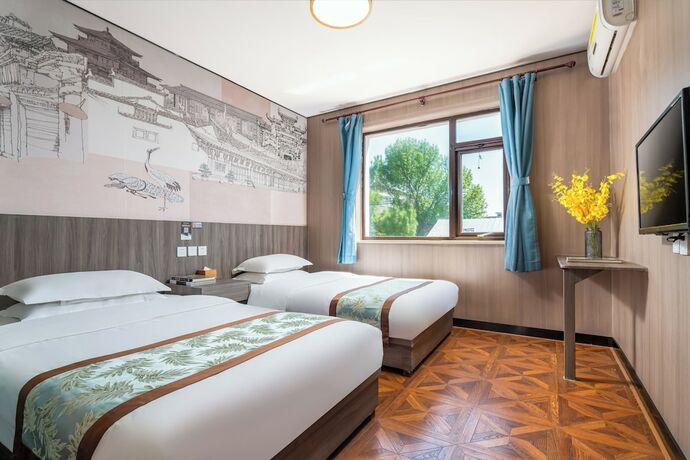 Imagen de la habitación del Hotel Dongfang Shengda Cultural. Foto 18