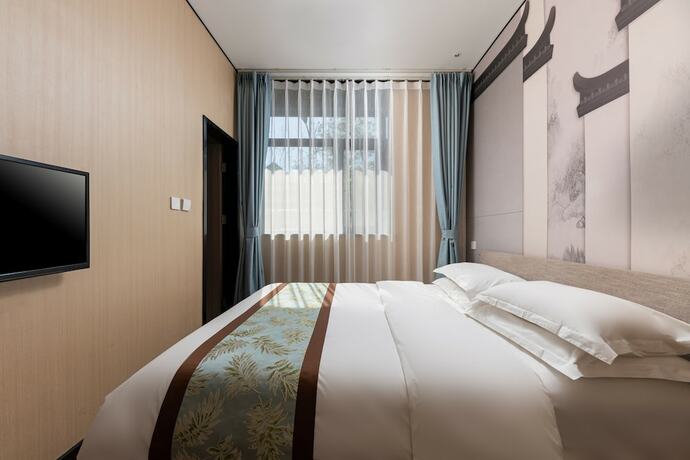 Imagen de la habitación del Hotel Dongfang Shengda Cultural. Foto 19
