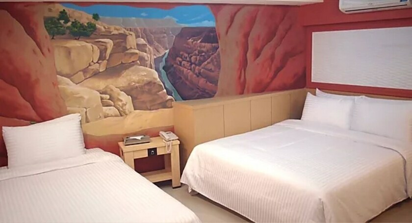 Imagen de la habitación del Hotel Dongmen. Foto 13