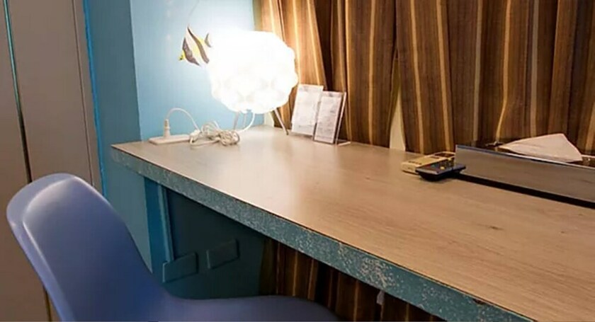 Imagen de la habitación del Hotel Dongmen. Foto 17