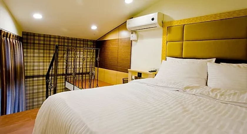Imagen de la habitación del Hotel Dongmen. Foto 21