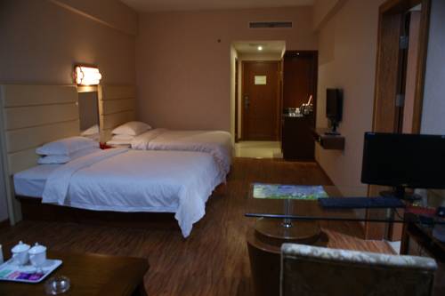 Imagen de la habitación del Hotel Dongxing Dequan. Foto 9