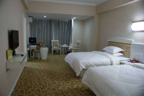 Imagen de la habitación del Hotel Dongxing Dequan. Foto 10