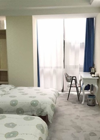 Imagen de la habitación del Hotel Dongyun Boutique. Foto 9