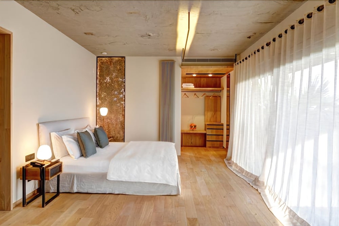 Imagen de la habitación del Hotel Donna Carmela Resort & Lodges. Foto 17