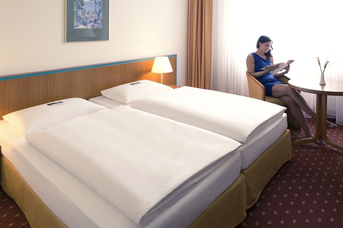 Imagen de la habitación del Hotel Dorint Leipzig. Foto 11