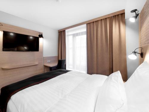 Imagen de la habitación del Hotel Dormero Budapest. Foto 5