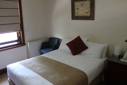 Imagen de la habitación del Hotel Dormie House. Foto 2