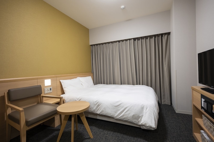 Imagen de la habitación del Hotel Dormy Inn Nagasakiekimae Hot Springs. Foto 12