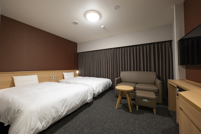 Imagen de la habitación del Hotel Dormy Inn Nagasakiekimae Hot Springs. Foto 13