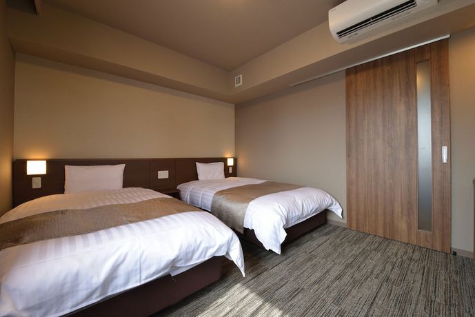 Imagen de la habitación del Hotel Dormy Inn Takamatsuchuokoenmae Natural Hot Spring. Foto 17