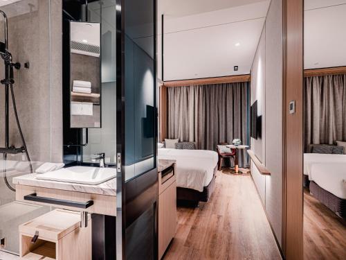 Imagen de la habitación del Hotel Dorsett Kai Tak, Kowloon. Foto 11