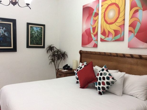 Imagen de la habitación del Hotel Dos Patios Querétaro Curamoria Collection. Foto 11