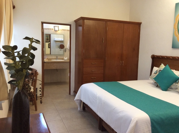 Imagen de la habitación del Hotel Dos Patios Querétaro Curamoria Collection. Foto 12