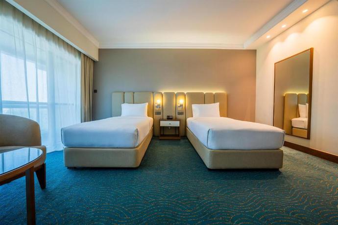 Imagen de la habitación del Hotel DoubleTree by Hilton Dubai Port Saeed. Foto 7