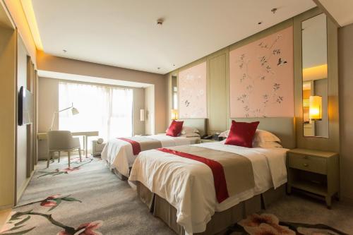 Imagen de la habitación del Hotel DoubleTree by Hilton Weihai. Foto 4