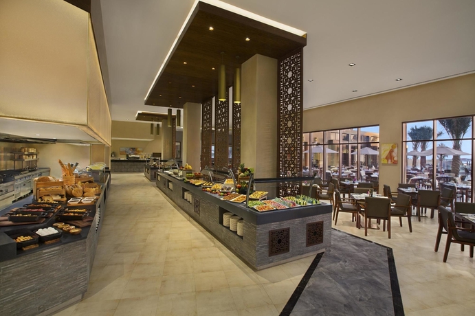 Imagen del bar/restaurante del Hotel Doubletree By Hilton Marjan Island Resort and Spa. Foto 4