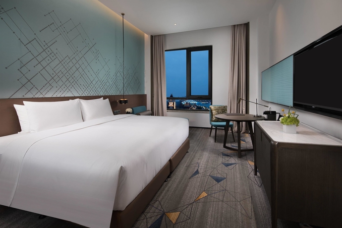 Imagen de la habitación del Hotel Doubletree By Hilton Qingdao Oriental Movie Metropolis. Foto 12