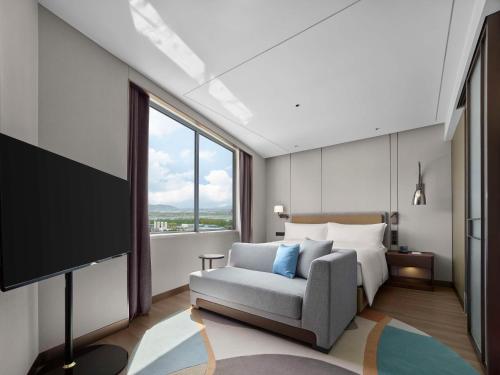 Imagen de la habitación del Hotel Doubletree By Hilton Yantai Golden Coast & Suites. Foto 11