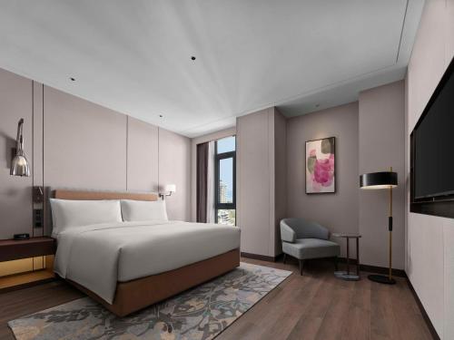 Imagen de la habitación del Hotel Doubletree By Hilton Yantai Golden Coast & Suites. Foto 14