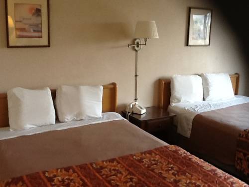 Imagen de la habitación del Hotel Downey Inn Luxury Suites. Foto 10