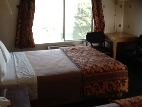 Imagen de la habitación del Hotel Downey Inn Luxury Suites. Foto 13