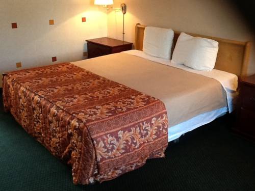 Imagen de la habitación del Hotel Downey Inn Luxury Suites. Foto 16
