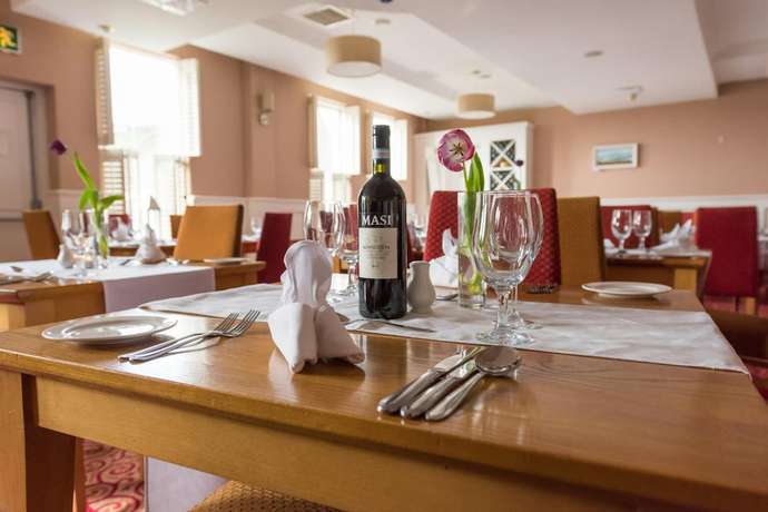 Imagen del bar/restaurante del Hotel Downings Bay. Foto 9