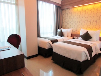 Imagen de la habitación del Hotel D'primahotel Mega Kuningan. Foto 13