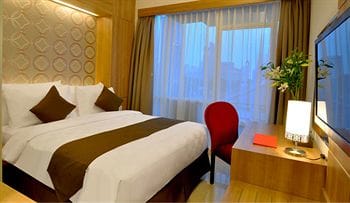 Imagen de la habitación del Hotel D'primahotel Mega Kuningan. Foto 16