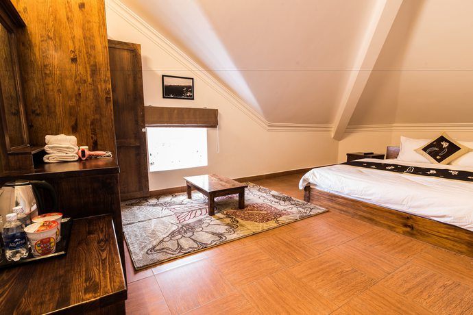 Imagen de la habitación del Hotel Dragon Dalat Villa. Foto 15