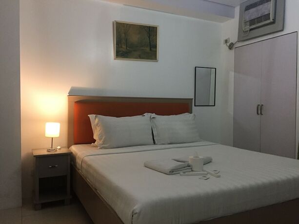 Imagen de la habitación del Hotel Dragonlink Suites. Foto 22