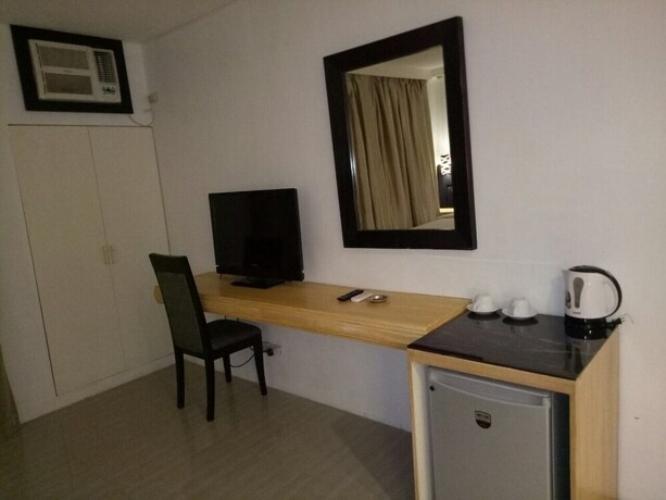 Imagen de la habitación del Hotel Dragonlink Suites. Foto 24