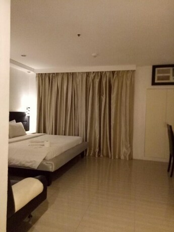 Imagen de la habitación del Hotel Dragonlink Suites. Foto 28