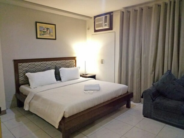 Imagen de la habitación del Hotel Dragonlink Suites. Foto 31