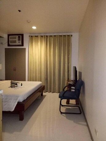 Imagen de la habitación del Hotel Dragonlink Suites. Foto 33