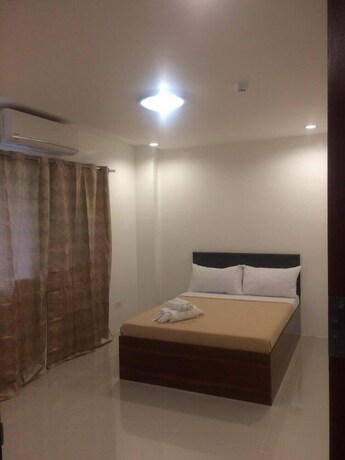 Imagen de la habitación del Hotel Dreamland Residences. Foto 15