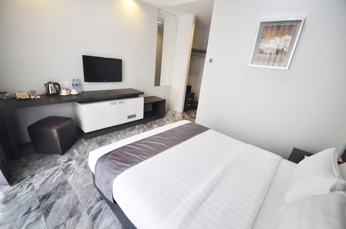 Imagen de la habitación del Hotel Dreamtel Jakarta. Foto 2