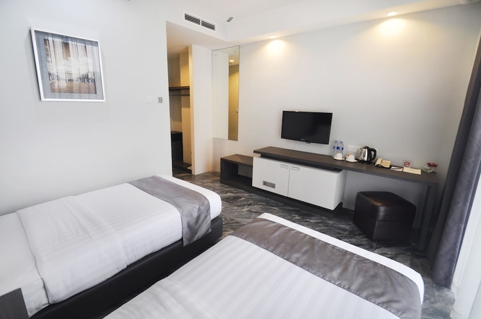Imagen de la habitación del Hotel Dreamtel Jakarta. Foto 7