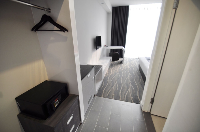 Imagen de la habitación del Hotel Dreamtel Jakarta. Foto 13