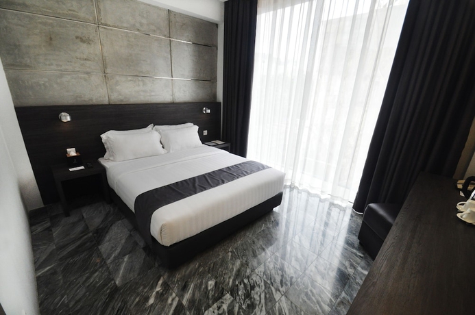 Imagen de la habitación del Hotel Dreamtel Jakarta. Foto 16