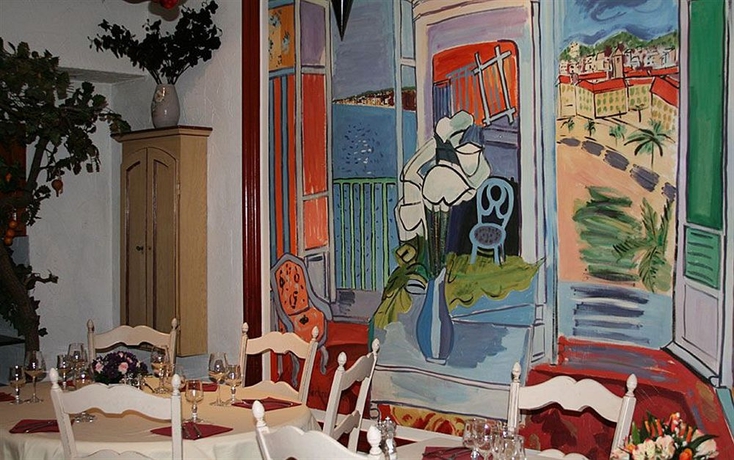 Imagen del bar/restaurante del Hotel Du Centre, Un Ammi. Foto 3