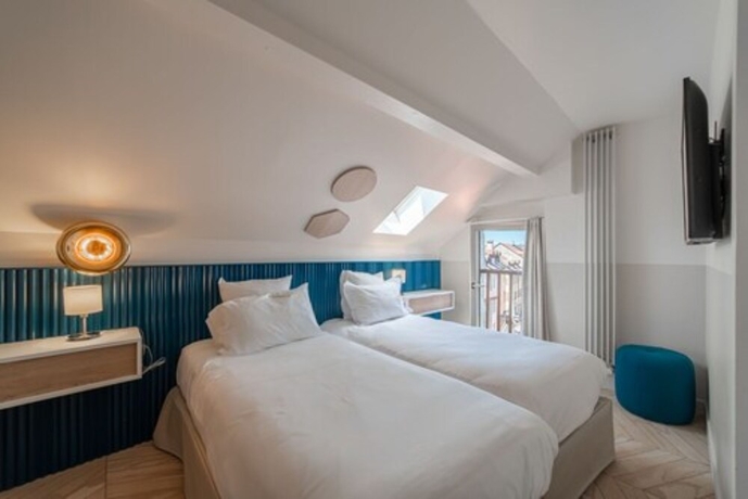 Imagen de la habitación del Hotel Du Palais De L'isle. Foto 15