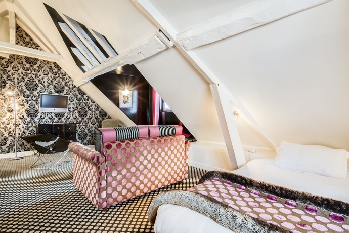 Imagen de la habitación del Hotel Du Petit Moulin. Foto 9