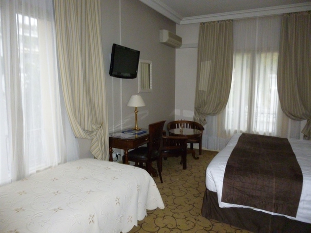 Imagen de la habitación del Hotel Du Petit Palais. Foto 14