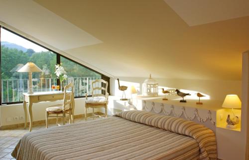 Imagen de la habitación del Hotel Du Po&egrave;te, Fontaine-de-Vaucluse. Foto 7