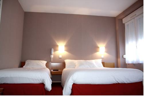 Imagen de la habitación del Hotel Du Touring. Foto 16