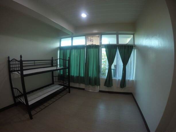Imagen de la habitación del Hotel Dumaguete Dormitel. Foto 17