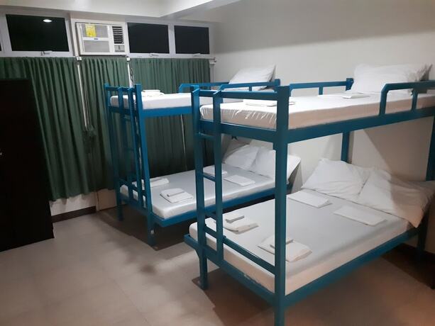 Imagen de la habitación del Hotel Dumaguete Dormitel. Foto 18