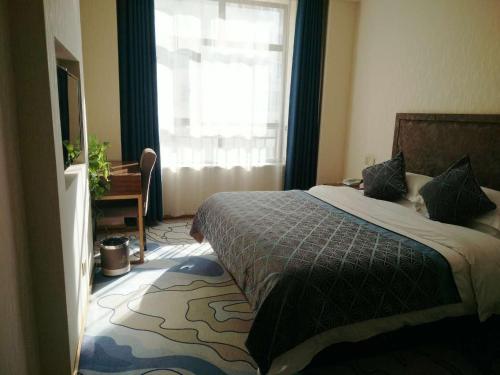 Imagen de la habitación del Hotel Dunhuang Dasheng Vacation. Foto 6